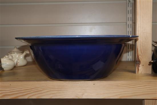 A 19th century Chinese white slip decorated blue ground basin diameter 34cm